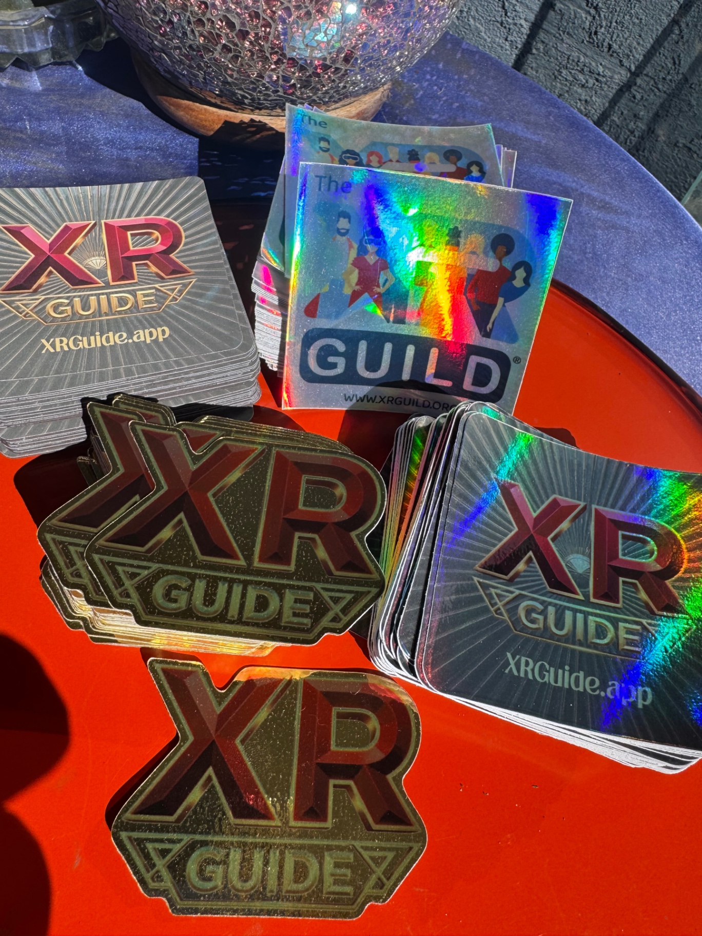 Holographic XRGuide stickers reflecting rainbow light