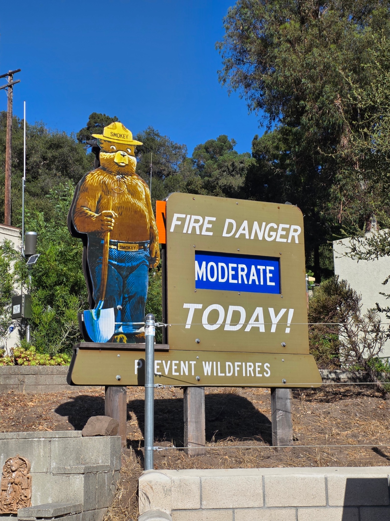 A Smokey Bear roadside sign in Los Angeles reading Fire Danger Moderate Today — Prevent Wildfires